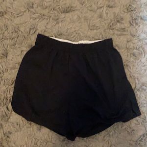 2 pairs of soffe shorts, one black and one blue